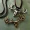 12 Packs: 2 ct. (24 total) Found Objects™ Oxidized Brass & Silver Elk Charms by Bead Landing™